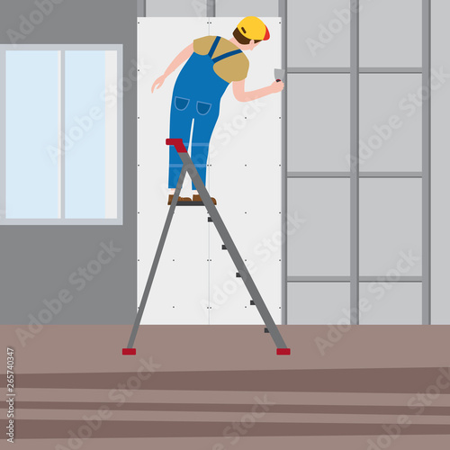 Professional working man on a stepladder applies plaster in imterior