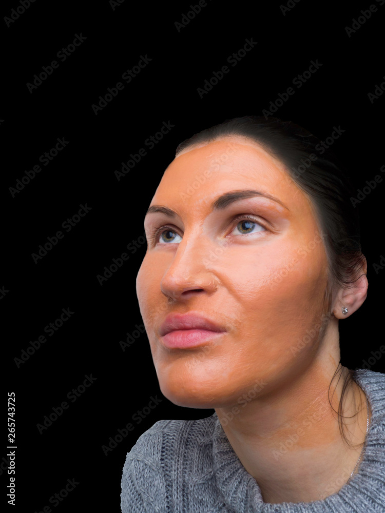 Obraz premium Young girl with facial mask Cosmetic procedure. Beauty spa and cosmetology.