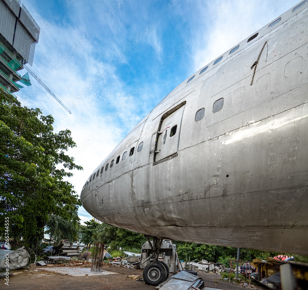 Obraz premium Flight Deck of Damage Airplane Being Repair At Outdoor Maintenance Area. Aircraft Being Scrapped and Disassemble in Graveyard or Junkyard.