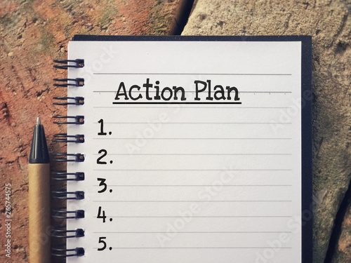 New Year Plan concept - Action Plan written on a notepad.