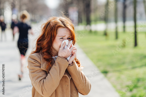 Young woman suffering from a pollen allergy photo