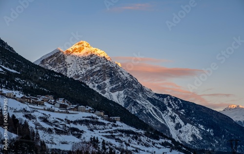 winter landscape (at sunset) of the high Valtellina, between the Italian central Alps, village of valdidentro, sondrio, italy