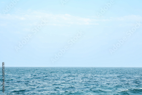 Blue sea water surface against sky. Space for text