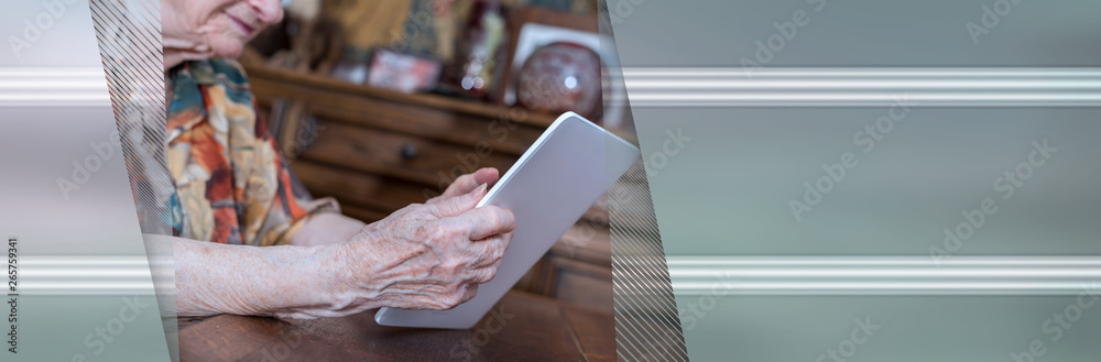 Obraz premium Senior woman using tablet. panoramic banner