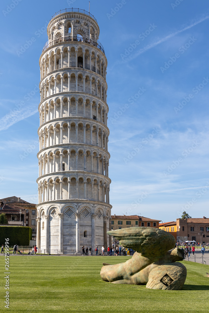 PISA, LIGURIA/ITALY  - APRIL 17 : Exterior view of the Leaning Tower of Pisa Liguria Italy on April 17, 2019. Three unidentified people