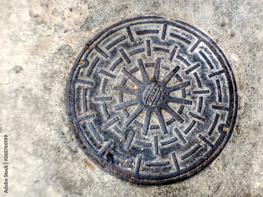 Drain cap isolated on cement background