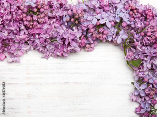 Lilac flowers on white wooden background, copy space,
