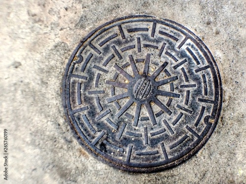 Drain cap isolated on cement background