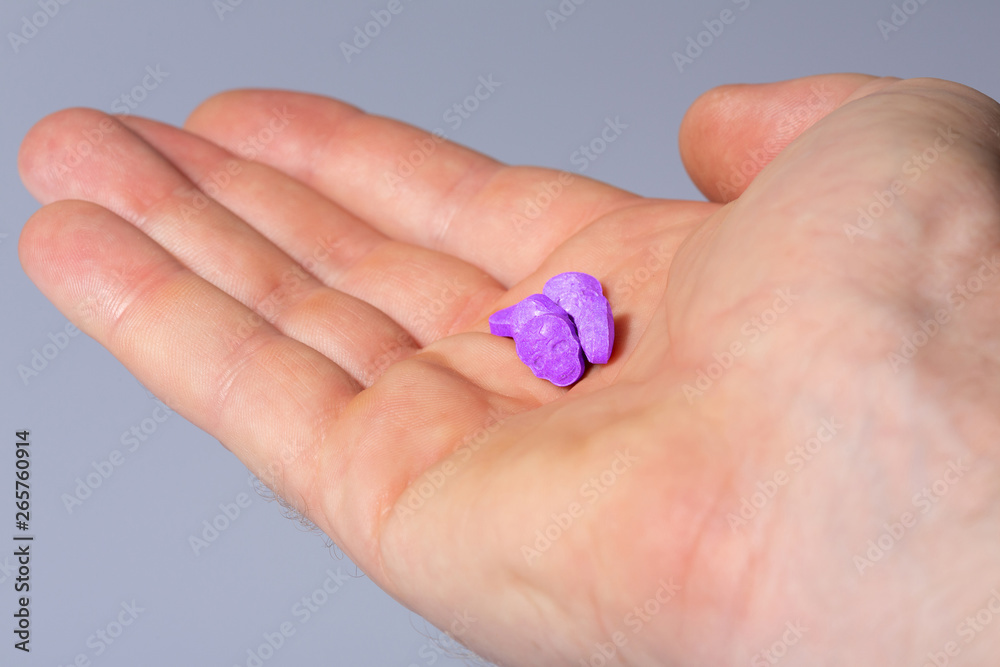amphetamine, Blue, pink, purple army Skull, Ecstasy, XTC pills isolated on a white background. amphetamine, Blue, pink, purple army Skull, Ecstasy, XTC pills isolated on a white background.