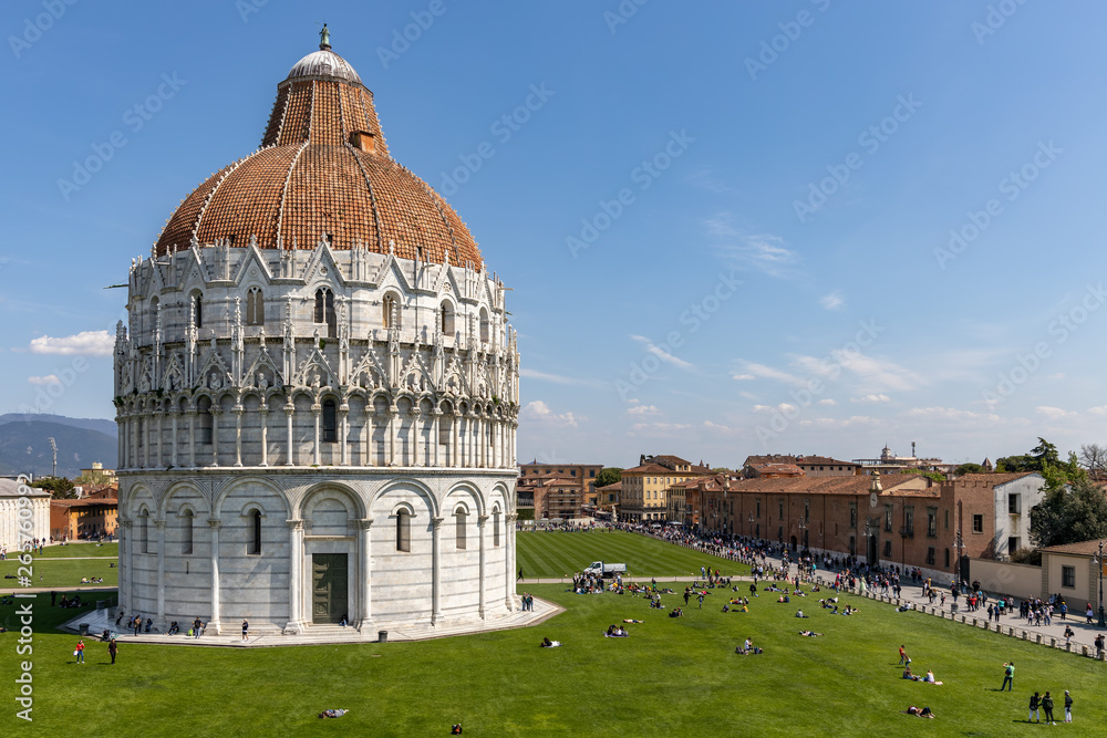 PISA, LIGURIA/ITALY  - APRIL 18 : Exterior view of the Baptistery in Pisa Liguria Italy on April 18, 2019. Unidentified people