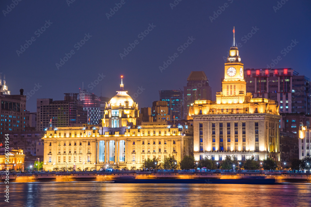 The bund of Shanghai huangpu river of tall buildings in the evening.