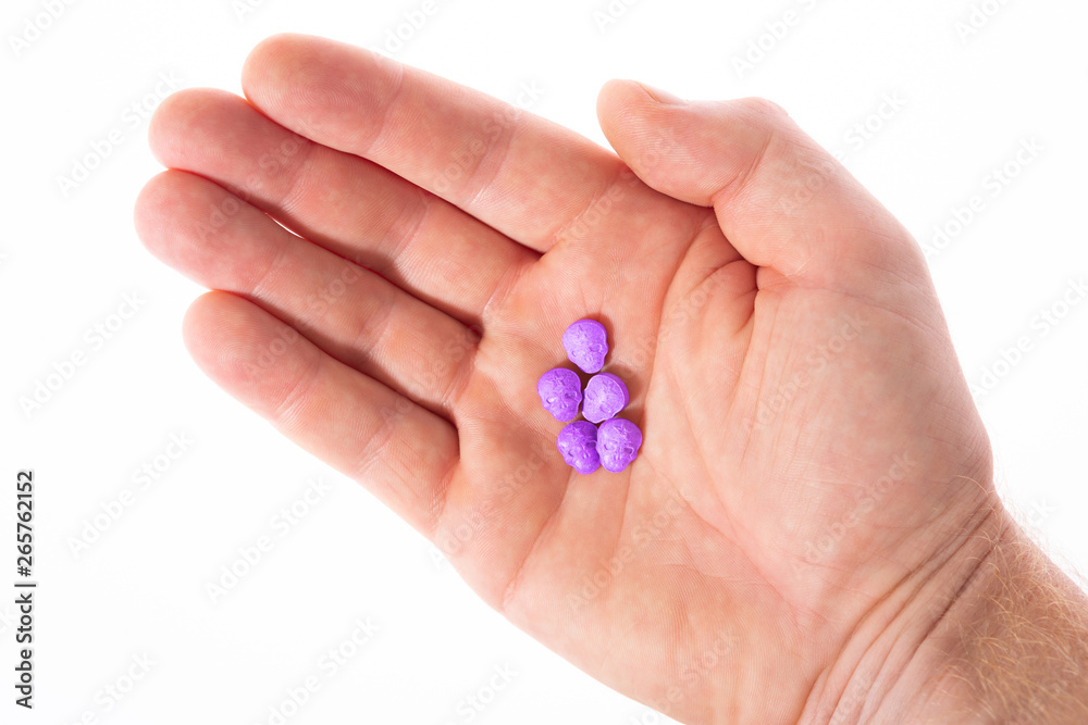 amphetamine, Blue, pink, purple army Skull, Ecstasy, XTC pills isolated on a white background. amphetamine, Blue, pink, purple army Skull, Ecstasy, XTC pills isolated on a white background.