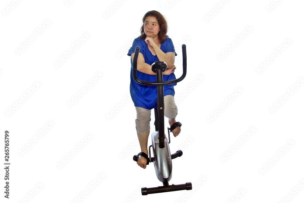 Fat women wear a blue shirt are exercising by cycling, isolated on white background. Fat women wear a blue shirt are exercising by cycling, isolated on white background.