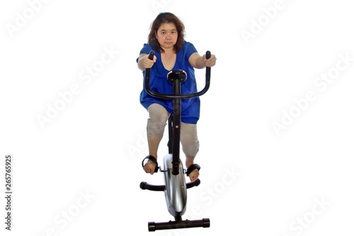 Fat women wear a blue shirt are exercising by cycling, isolated on white background.