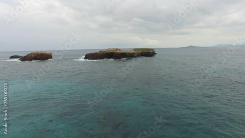 Aerial shot of waves breaking in a big rock formation, Marietas Islands, Nayarit, Mexico photo