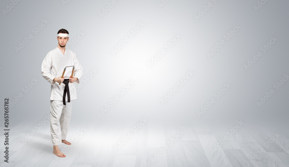 Young kung-fu trainer fighting in an empty space
Young kung-fu trainer fighting in an empty space