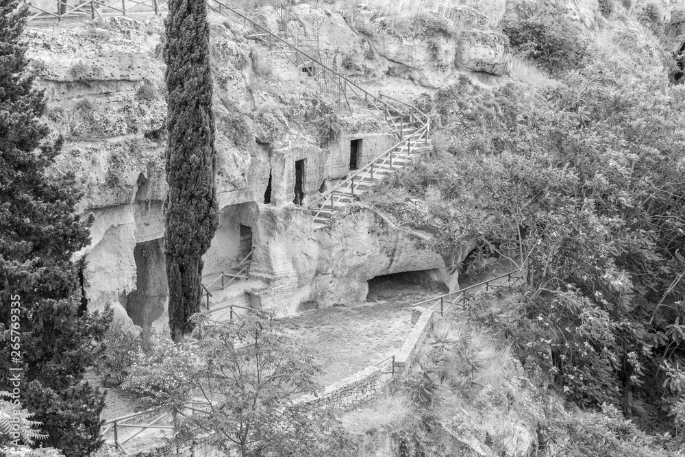 Massafra and its ravines. Houses built in the rock. Puglia in Black and White. Italy