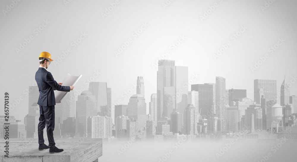 Architect standing on maze and looking at a future plan
Architect standing on maze and looking at a future plan