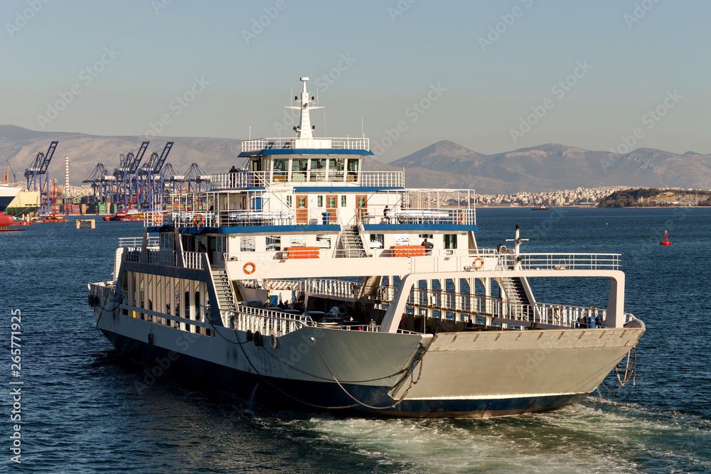 A swimming ferryboat on a sunny day