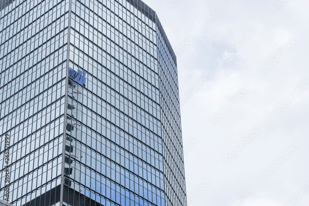Window glass, Modern architecture in the blue sky white cloud city Window glass, Modern architecture in the blue sky white cloud city