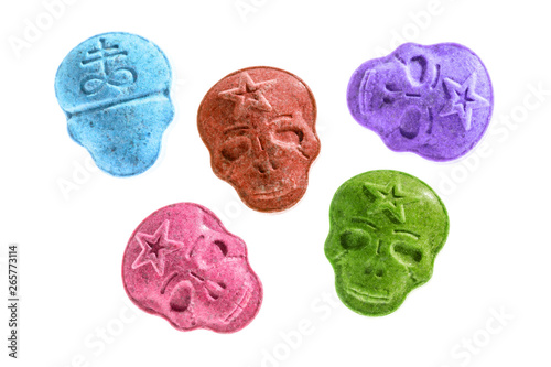 Party drugs: many coloured Amphetamine, Army Skull, Ecstasy, XTC pills isolated on a white background.