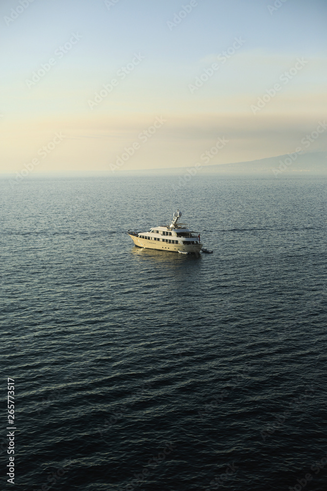 boat in the sea, mountain on the background of the sea.