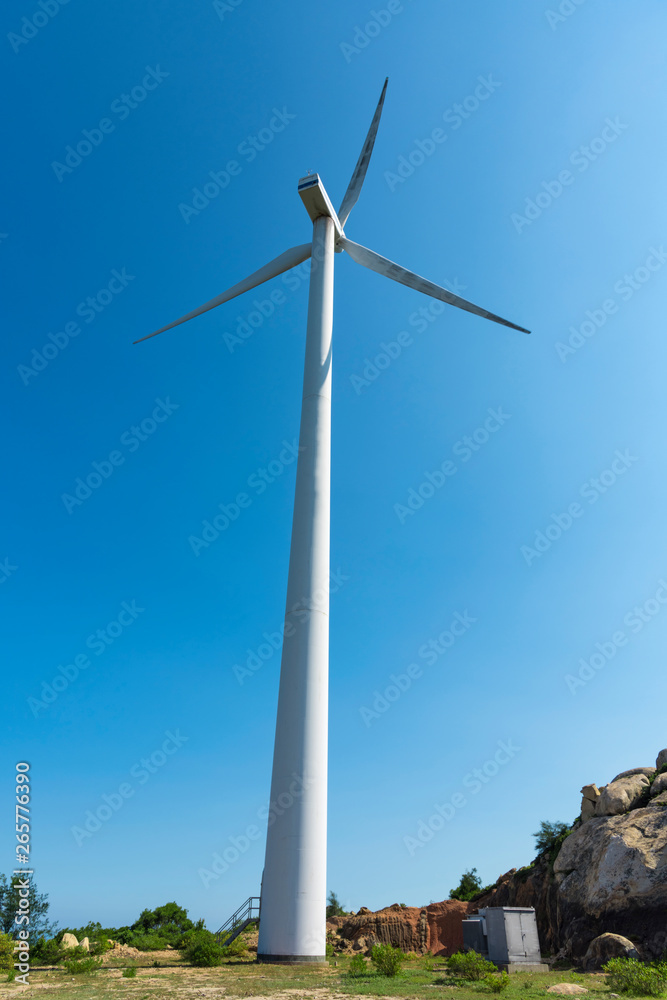 Wind turbines in the mountains near the sea Wind turbines in the mountains near the sea