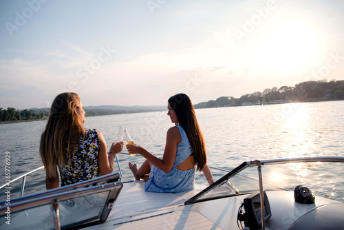 Girls on a boat drinking