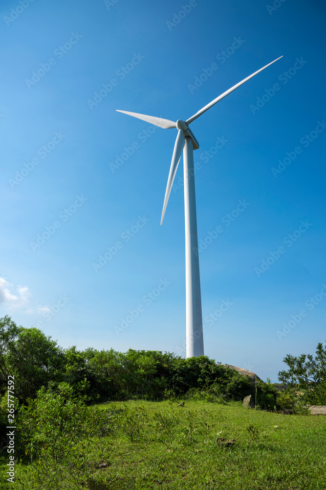 Wind turbines in the mountains near the sea