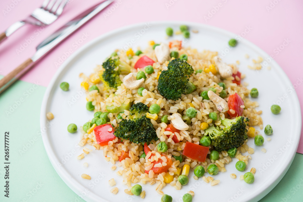 Vegetarian food. Bulgur with vegetables, broccoli, paprika and nuts. Healthy food. Vegetarian food. Bulgur with vegetables, broccoli, paprika and nuts. Healthy food.