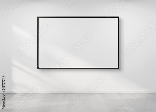 Fototapeta Naklejka Na Ścianę i Meble -  Black frame hanging on a wall mockup 3d rendering