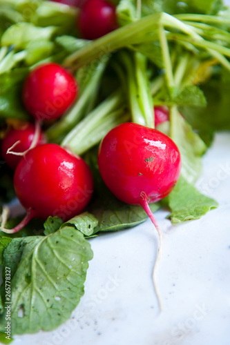 Red radishes on the white table