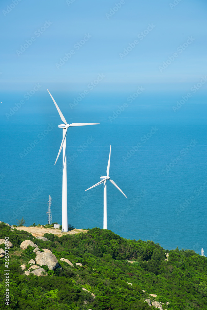 Wind turbines in the mountains near the sea