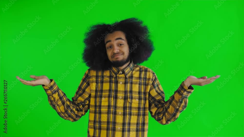 Portrait of helpless african american man throwing hands aside and