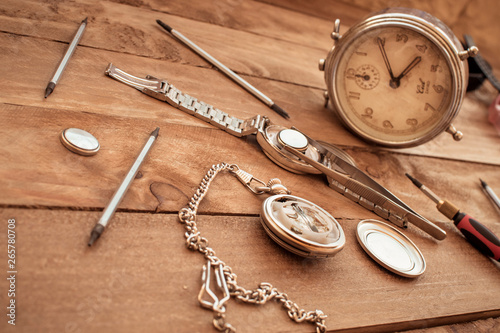 Watchmaker changing the stack of a clock.