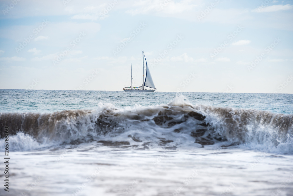 Seascape with white sailboat