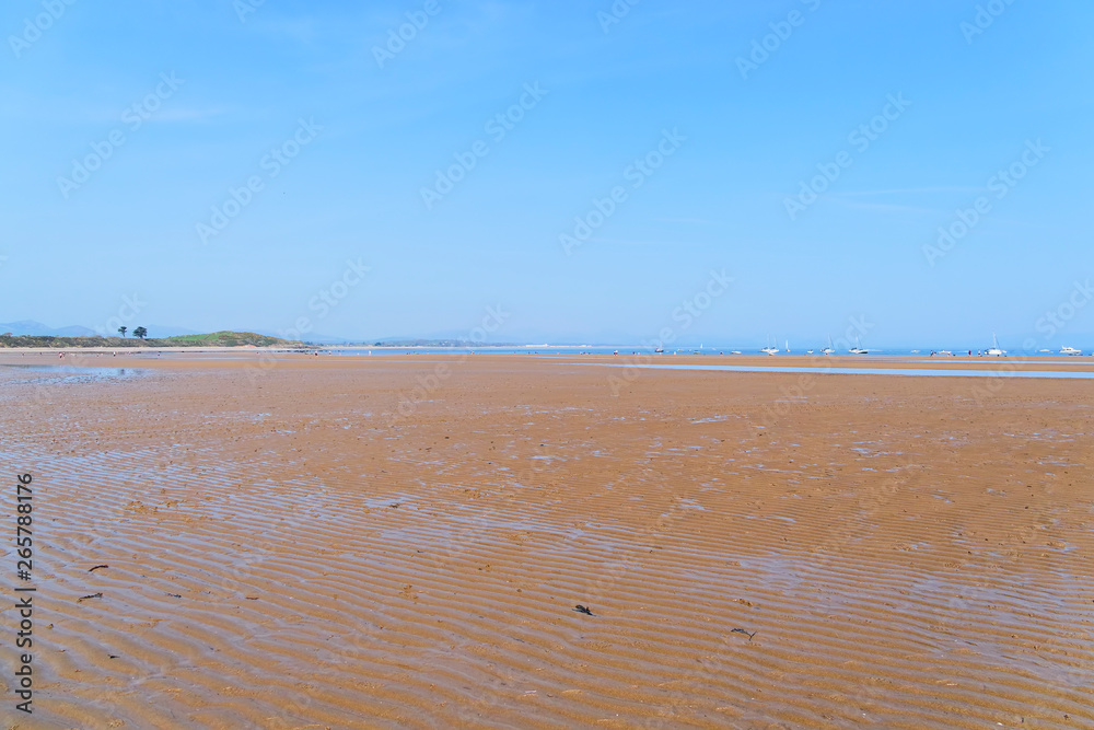 The wide expanse of Llanbedrog beach on the Llyn Peninsula at low tide The wide expanse of Llanbedrog beach on the Llyn Peninsula at low tide