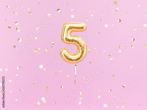 Five year birthday. Number 5 flying foil balloon on pink. Five-year anniversary gold confetti background. 3d rendering