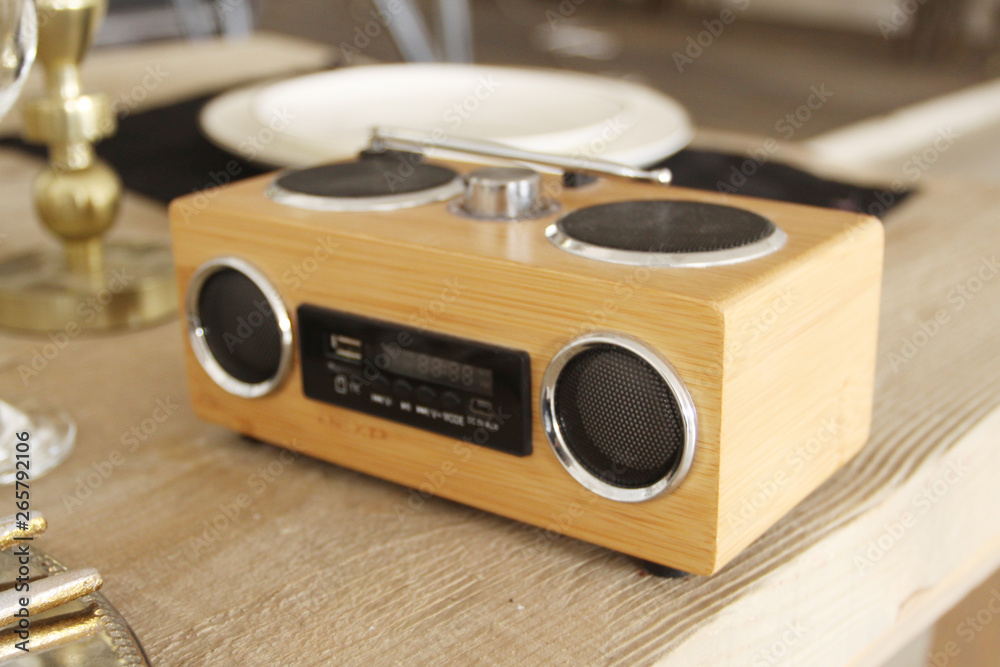 Fototapeta premium Old tape recorder on a wooden table