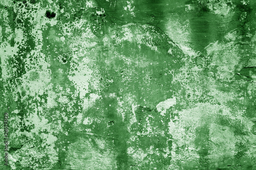 Grungy cement wall texture in green tone.