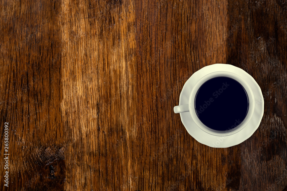 Coffee served on an old wooden table. View from above. Empty space for copying and pasting text. Coffee served on an old wooden table. View from above. Empty space for copying and pasting text.