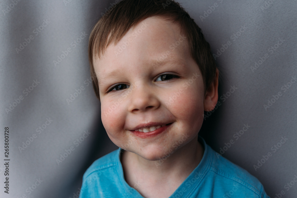 naughty boy smiling at camera, portrait of a child naughty boy smiling at camera, portrait of a child