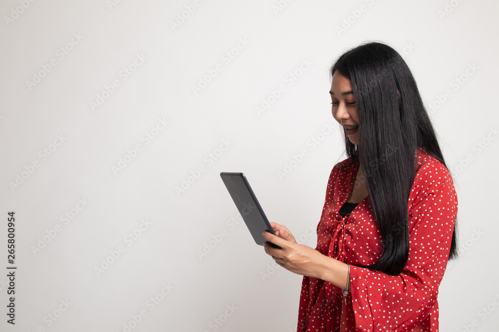 Young Asian woman with a computer tablet. Young Asian woman with a computer tablet.