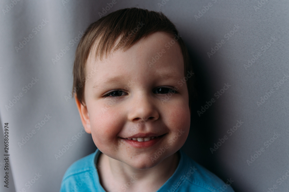 naughty boy smiling at camera, portrait of a child naughty boy smiling at camera, portrait of a child