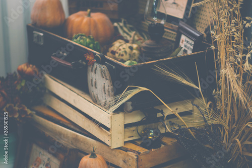 View of a showcase full of interesting old things for sale. Various vintage objects at a indoor flea market. Details of still life in the home vintage interior. Warm cosy autumn concept. Toned image. photo