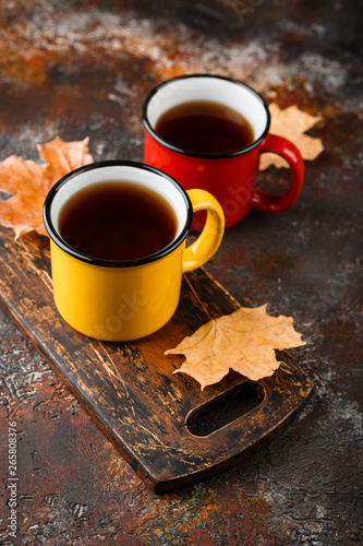 Enameled cup of hot tea photo