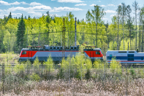 Modern high-speed train moves at spring morning time.
