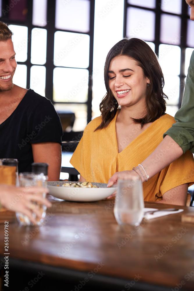 Waitress Serving Couple Meeting For Drinks And Food In Restaurant Waitress Serving Couple Meeting For Drinks And Food In Restaurant