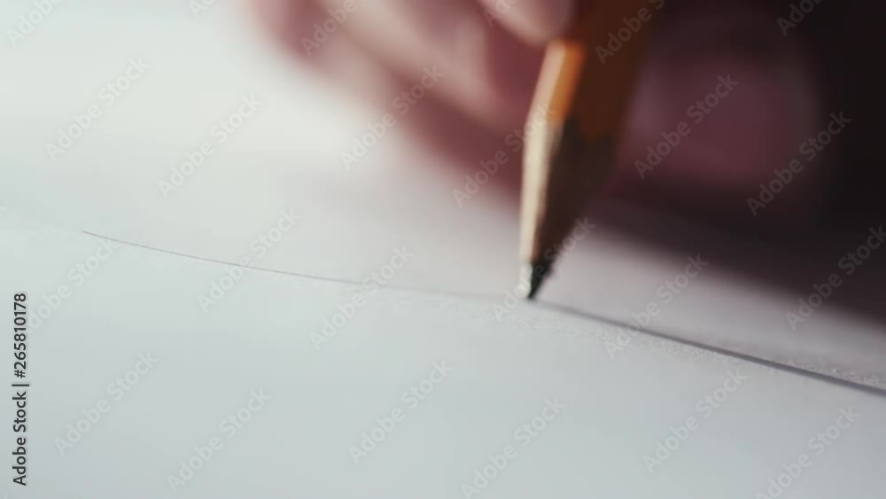 Selective extreme close up focus on drawing pencil in hands of painter, artist, designer or engineer. Drawing curves, lines. Design, plan, painting. Talent, creativity, profession concept