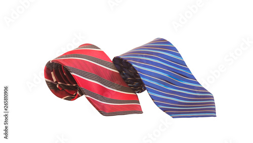 Stylish stried rolled neckties isolated on white. Selective focus.